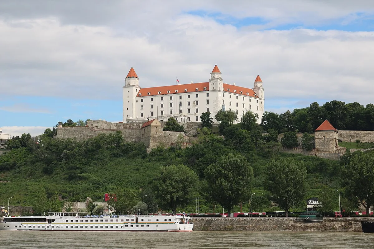 Visitor looking out from Bratislava Castle terrace over the Danube, Slovakia — 2